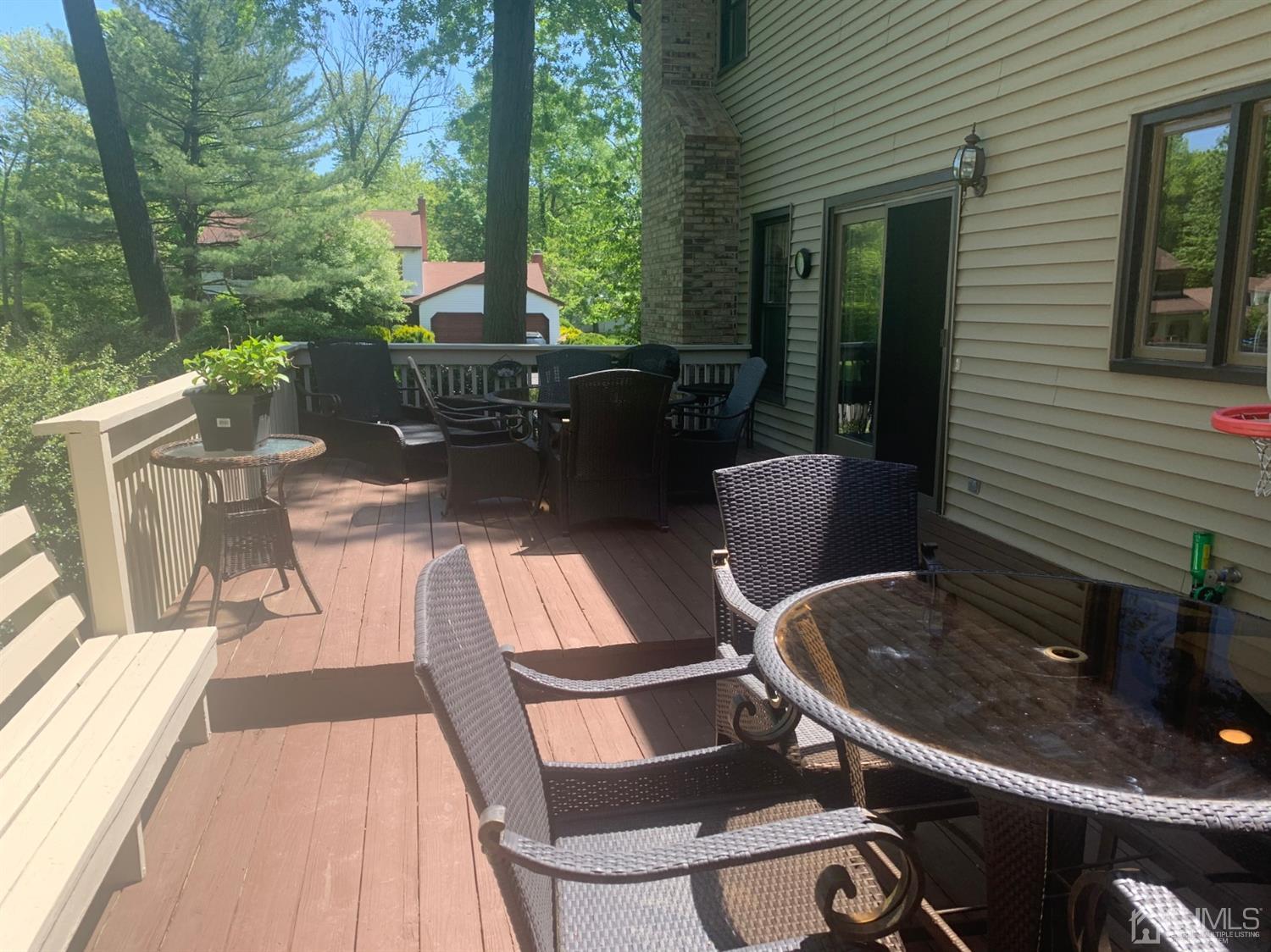 2 Fox Hill Road Edison, NJ 08820 - Photo 7 of 37 a view of a patio with table and chairs potted plants with wooden floor and fence