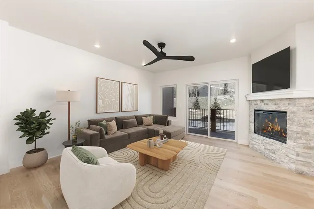 a living room with furniture fireplace and a flat screen tv