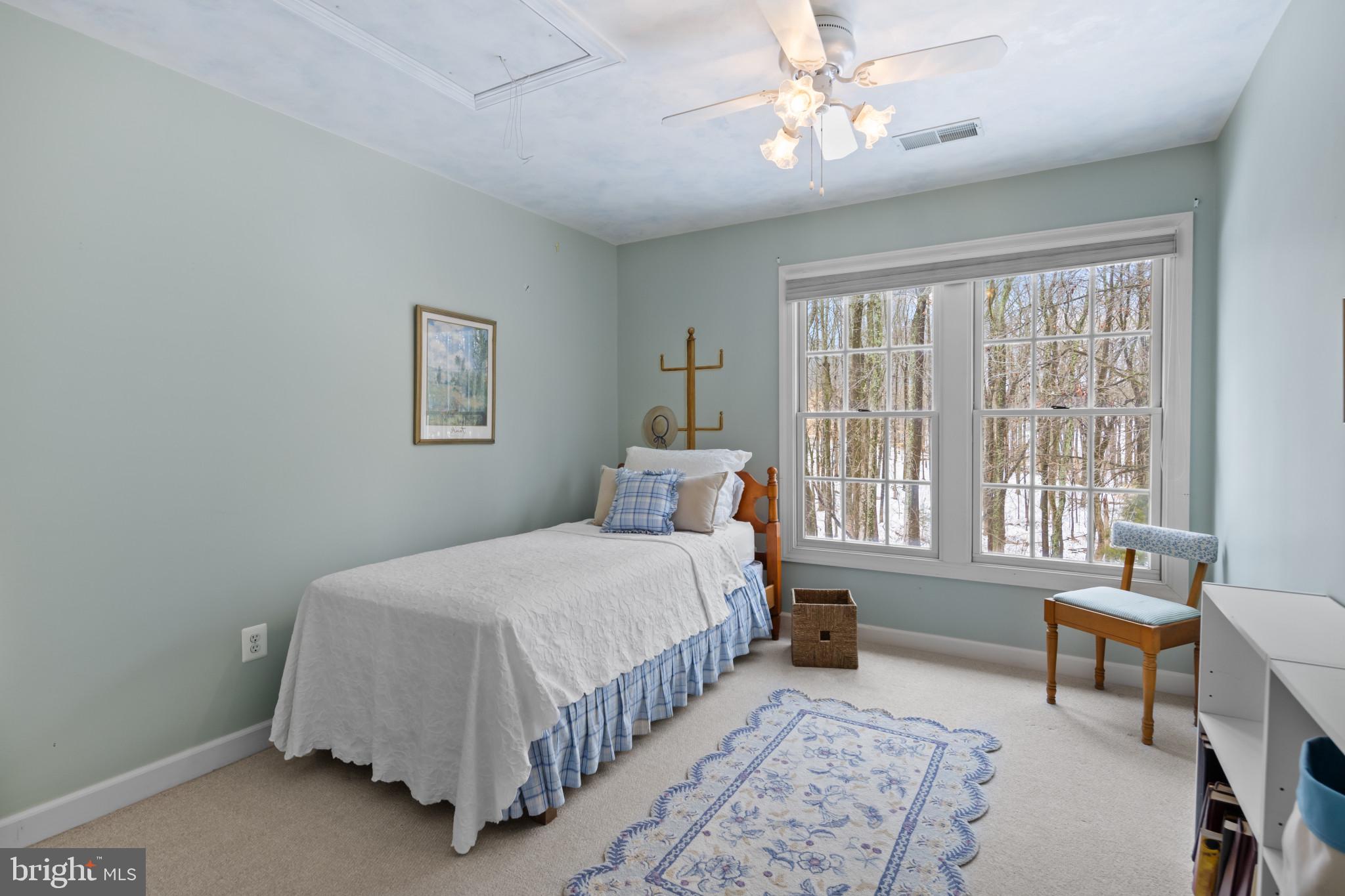 91 Colony Crossing Edgewater, MD 21037 - Photo 20 of 38 a bedroom with a bed couch and windows