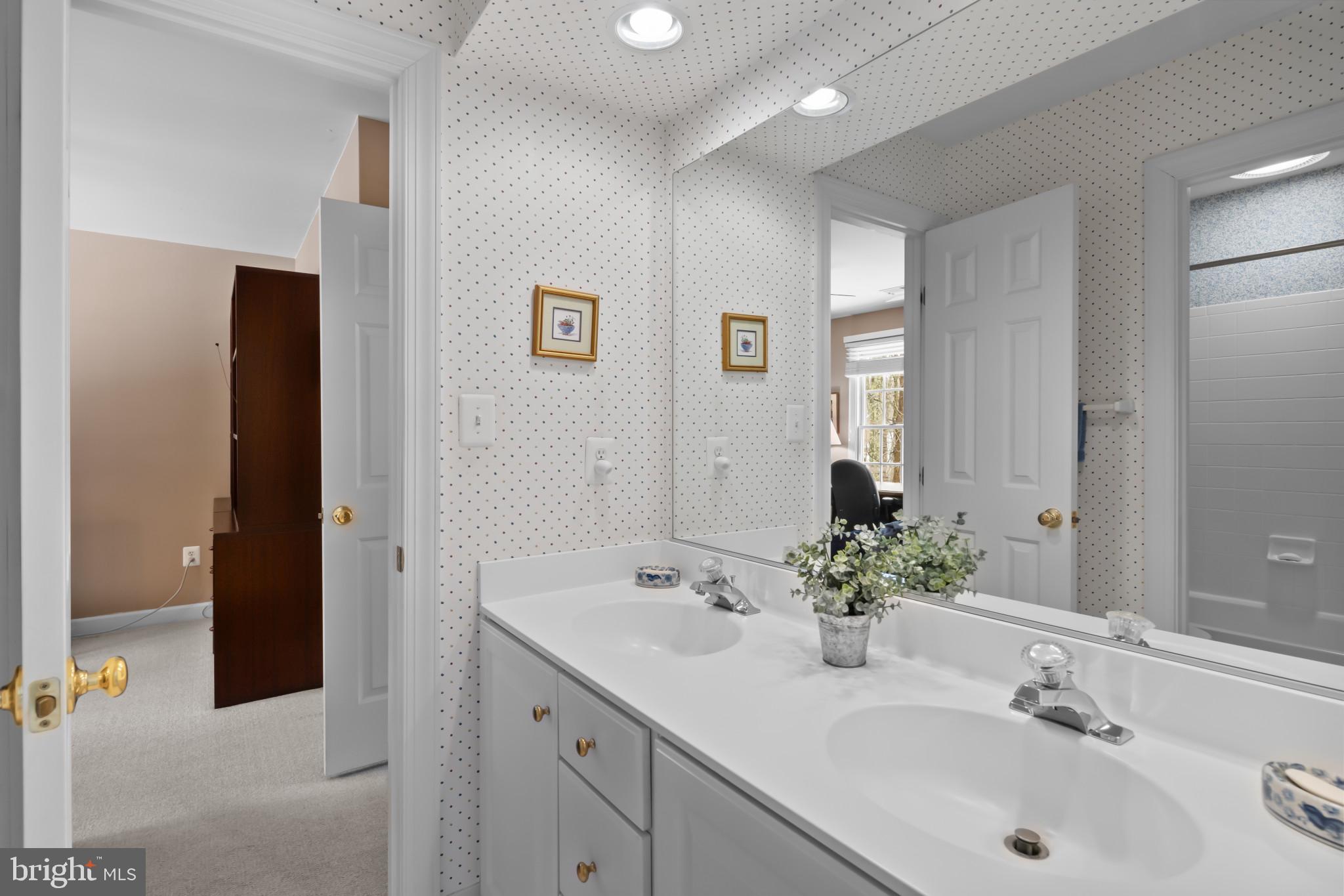 91 Colony Crossing Edgewater, MD 21037 - Photo 22 of 38 a bathroom with a sink and a mirror