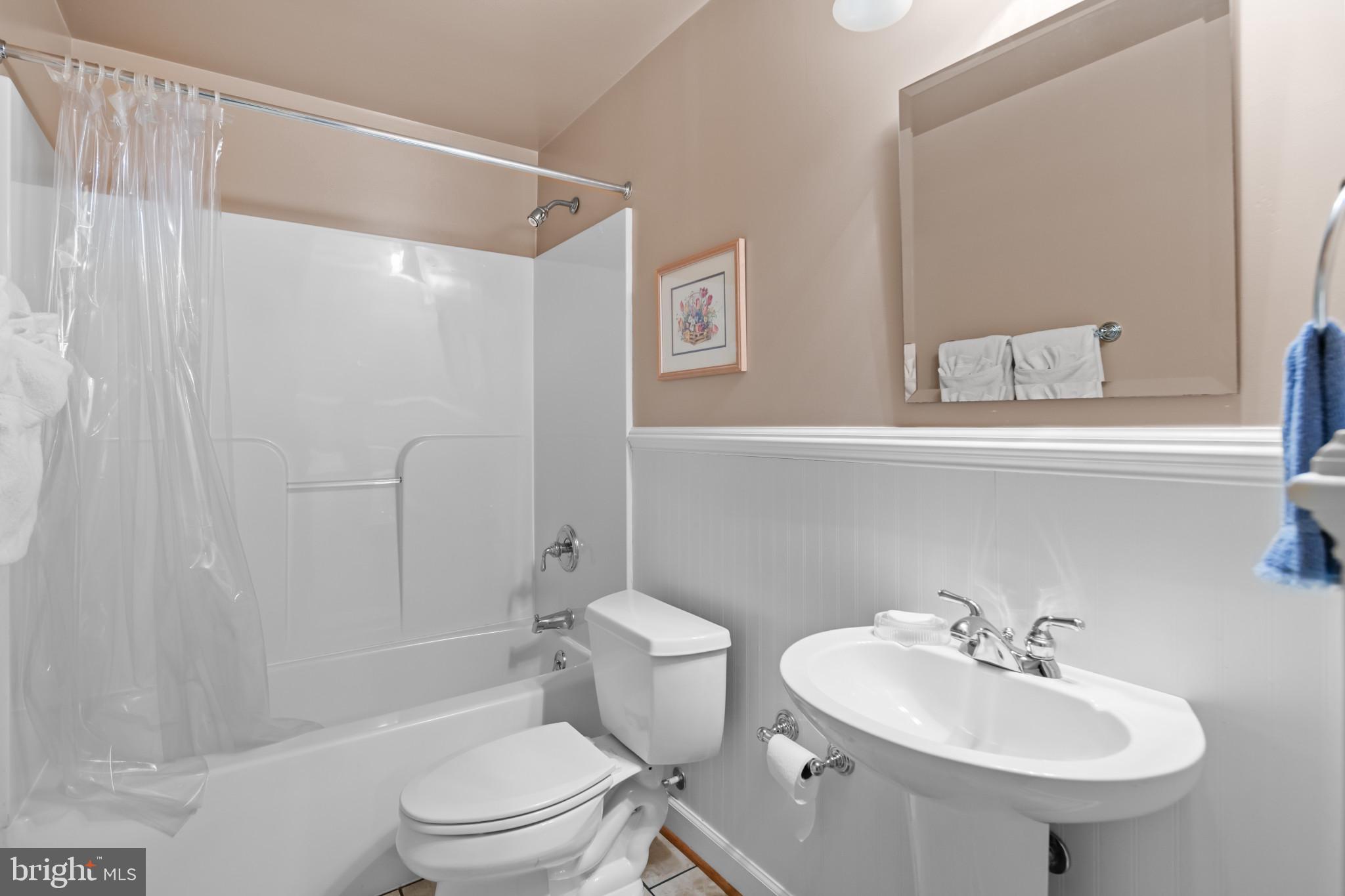 91 Colony Crossing Edgewater, MD 21037 - Photo 30 of 38 a bathroom with a sink toilet and shower