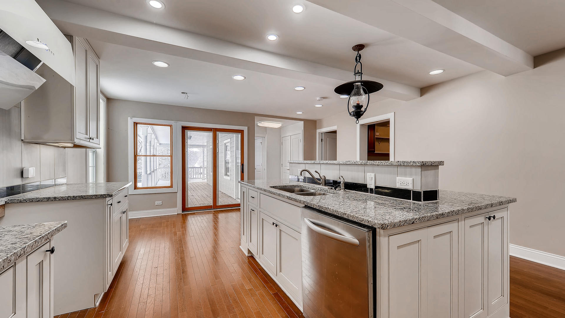 270 Country Commons Road Cary, IL 60013 - Photo 11 of 39 a kitchen with stainless steel appliances granite countertop a sink stove and wooden floor