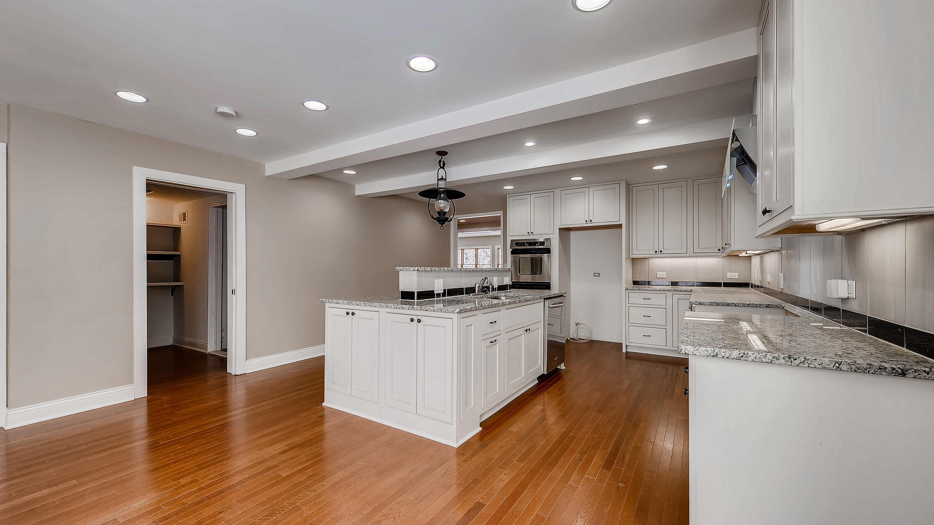 270 Country Commons Road Cary, IL 60013 - Photo 12 of 39 a kitchen with stainless steel appliances granite countertop a sink a stove a refrigerator and a microwave