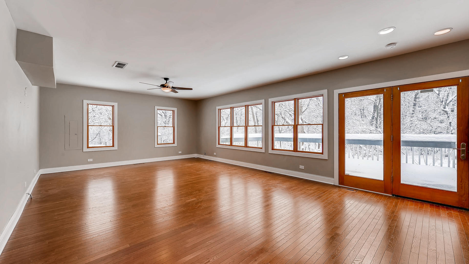 270 Country Commons Road Cary, IL 60013 - Photo 14 of 39 a view of an empty room with wooden floor and a window