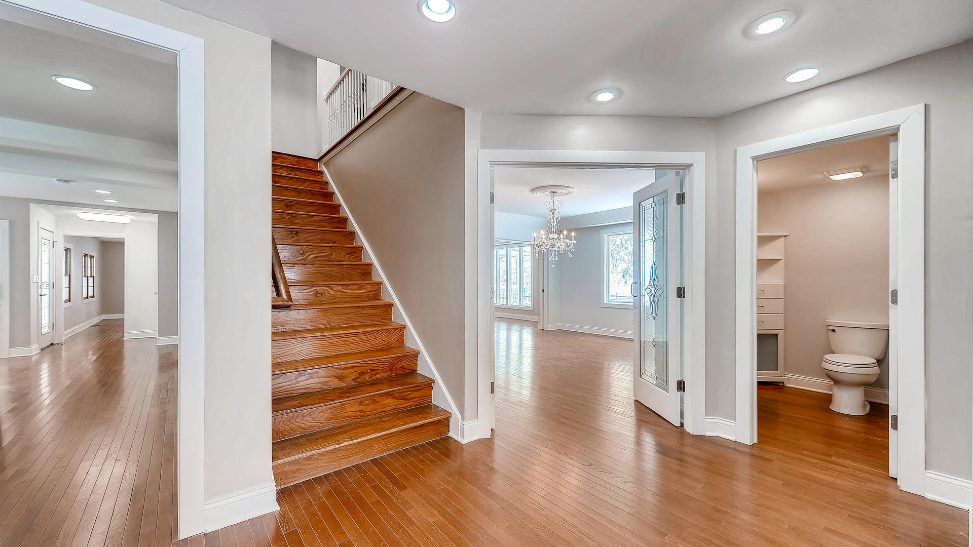 270 Country Commons Road Cary, IL 60013 - Photo 18 of 39 a view of a hallway with wooden floor and a bathroom