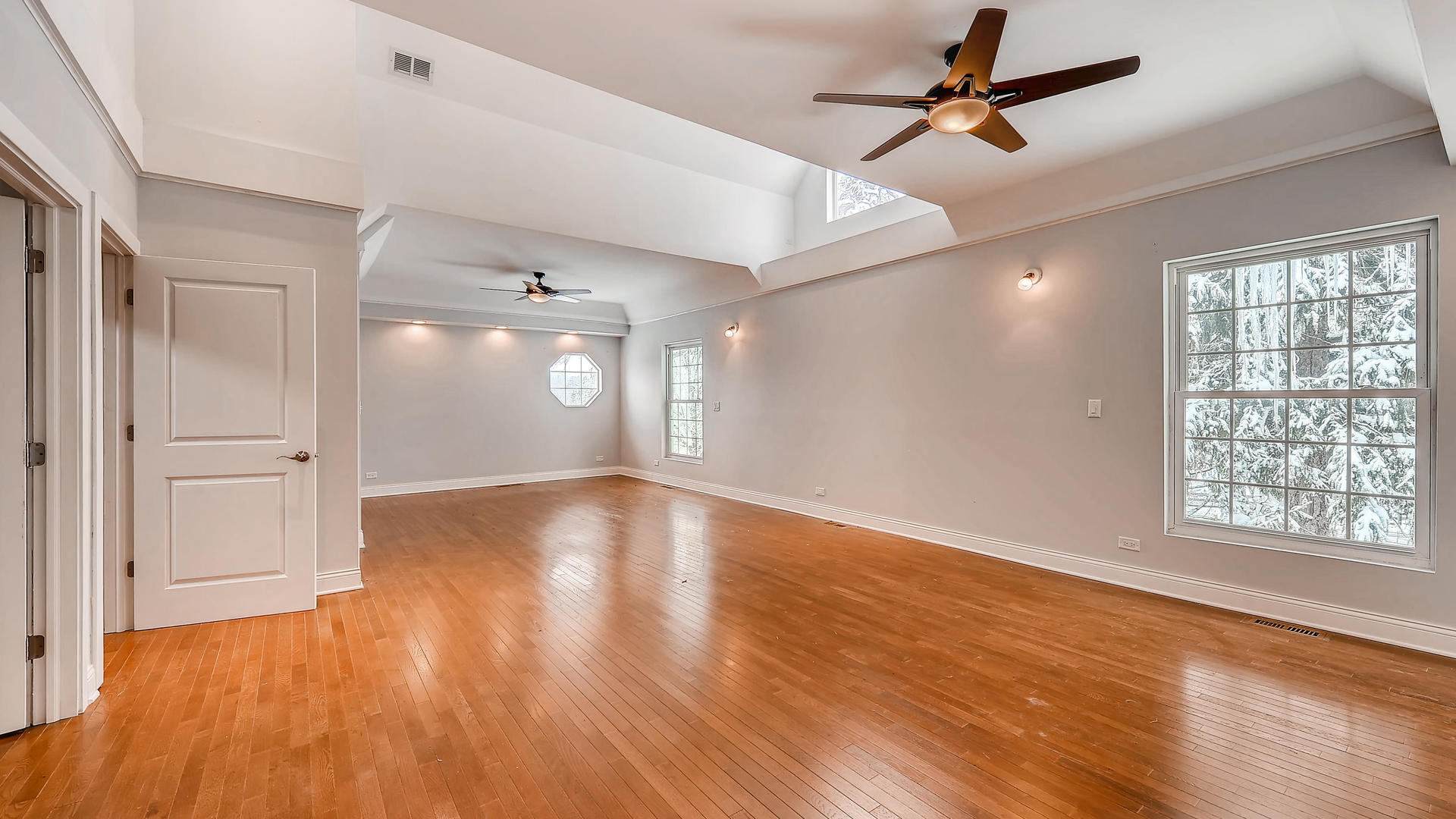 270 Country Commons Road Cary, IL 60013 - Photo 19 of 39 a view of empty room with wooden floor and fan
