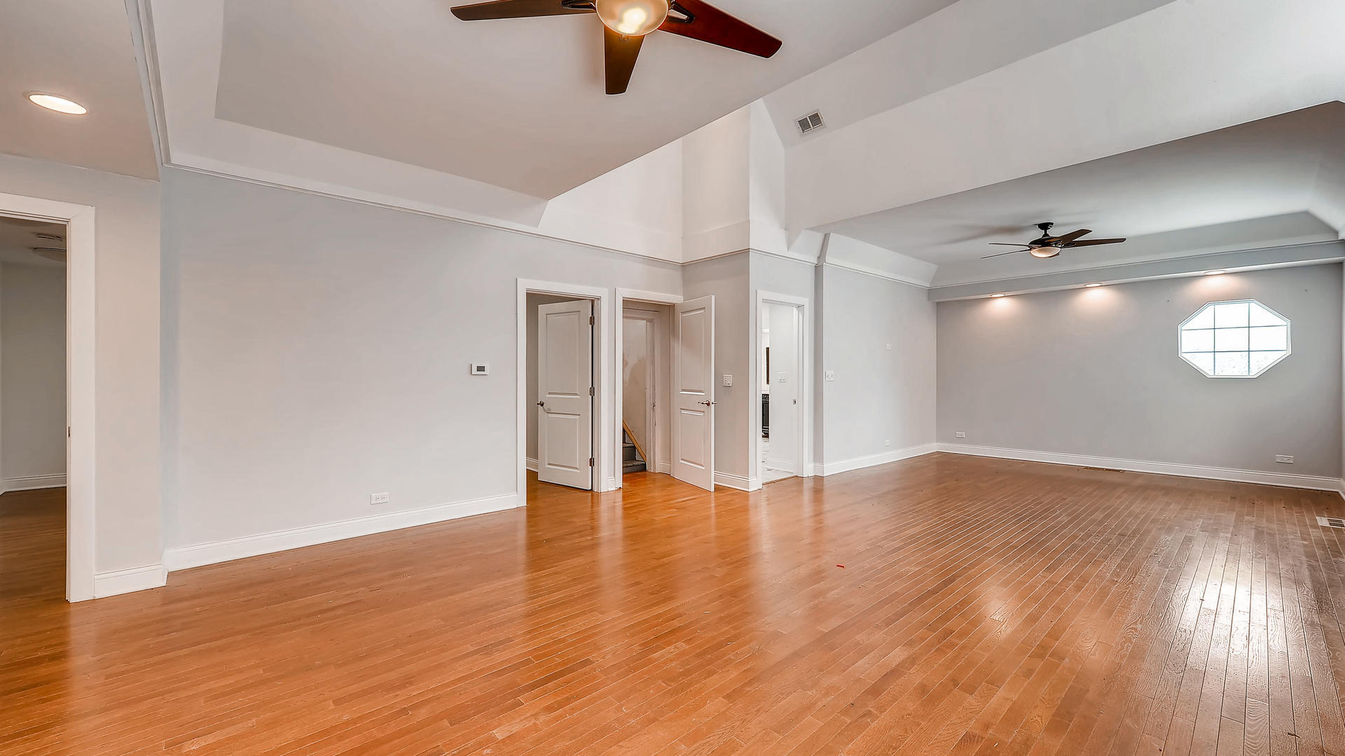 270 Country Commons Road Cary, IL 60013 - Photo 20 of 39 a view of an empty room with wooden floor and a window