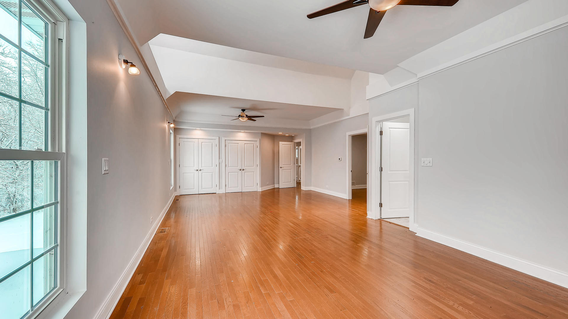 270 Country Commons Road Cary, IL 60013 - Photo 21 of 39 a view of an empty room with wooden floor and a window