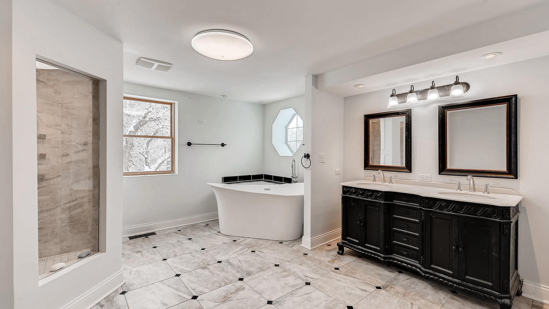 270 Country Commons Road Cary, IL 60013 - Photo 22 of 39 a spacious bathroom with a double vanity sink a mirror and a bathtub