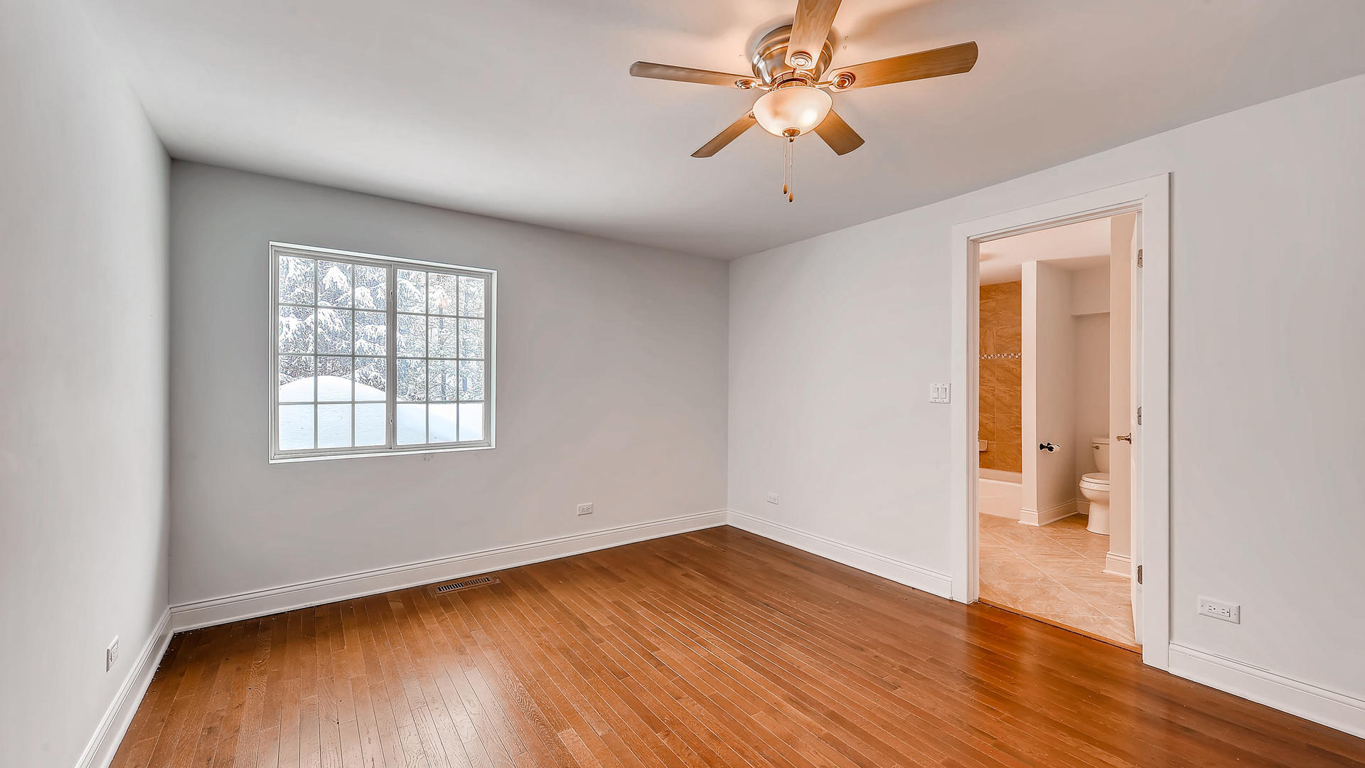 270 Country Commons Road Cary, IL 60013 - Photo 25 of 39 an empty room with wooden floor and windows