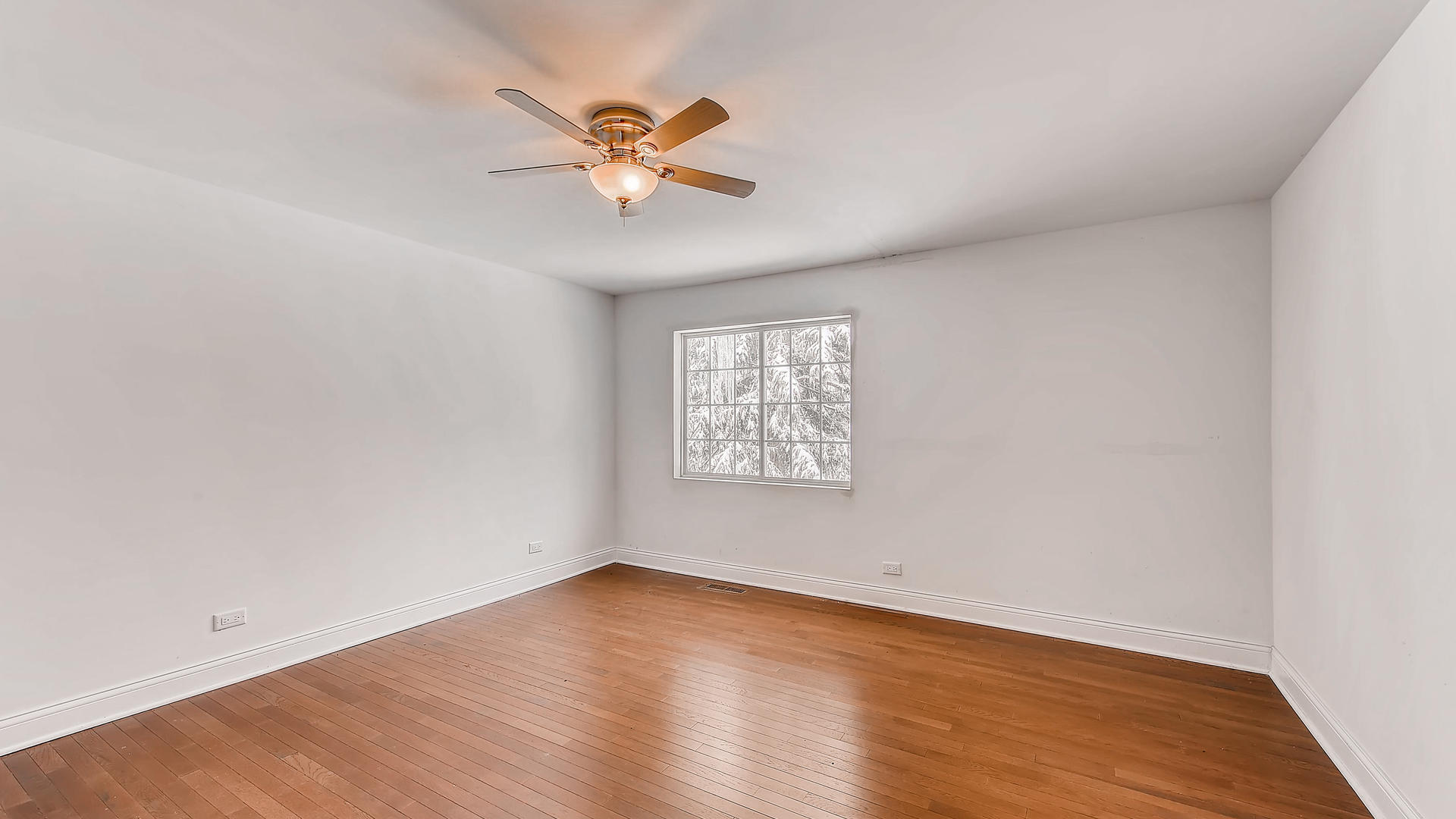 270 Country Commons Road Cary, IL 60013 - Photo 27 of 39 a view of an empty room with wooden floor and a window