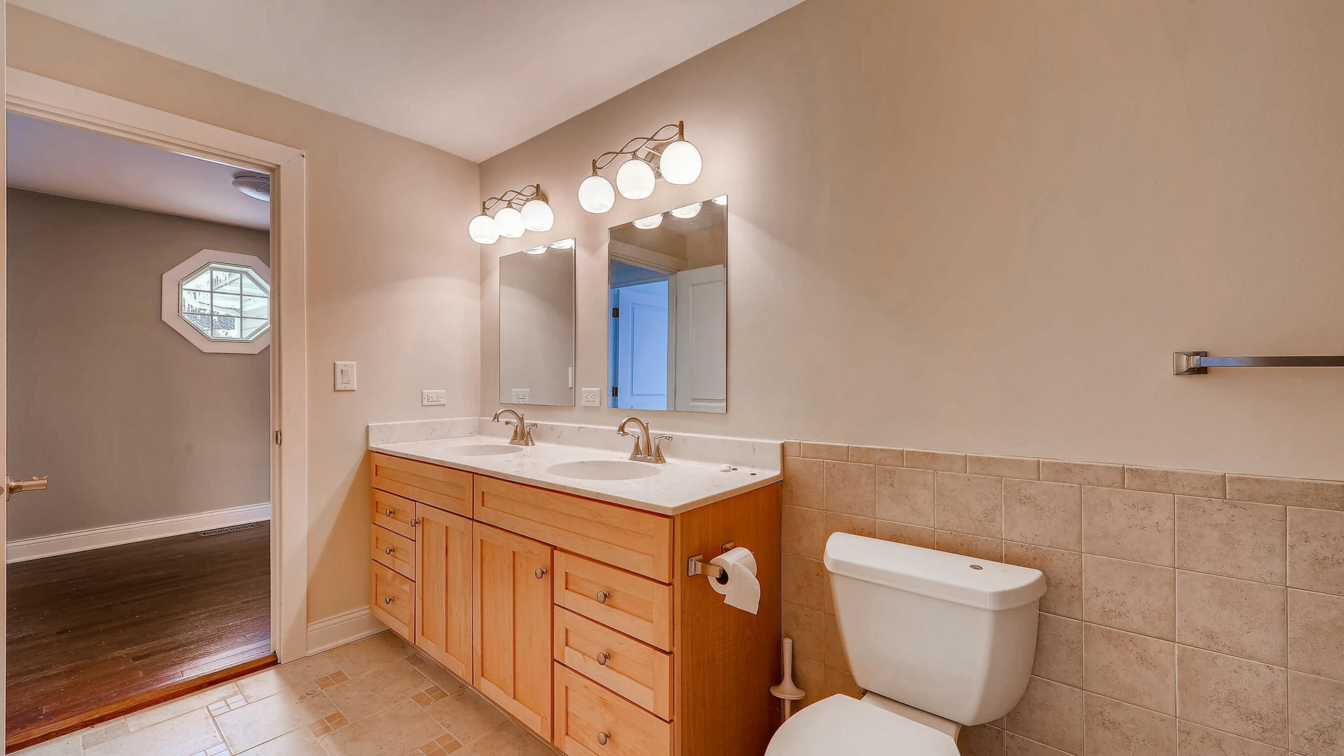 270 Country Commons Road Cary, IL 60013 - Photo 29 of 39 a bathroom with a toilet sink and mirror