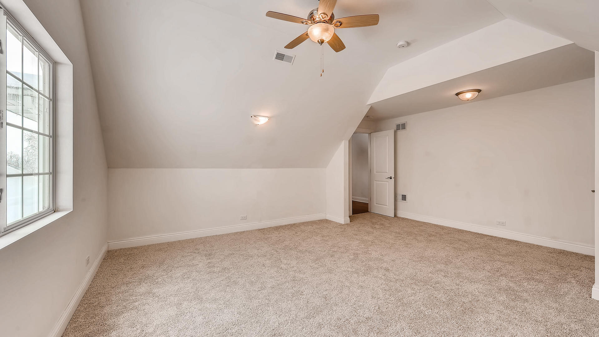 270 Country Commons Road Cary, IL 60013 - Photo 33 of 39 an empty room with windows and fan