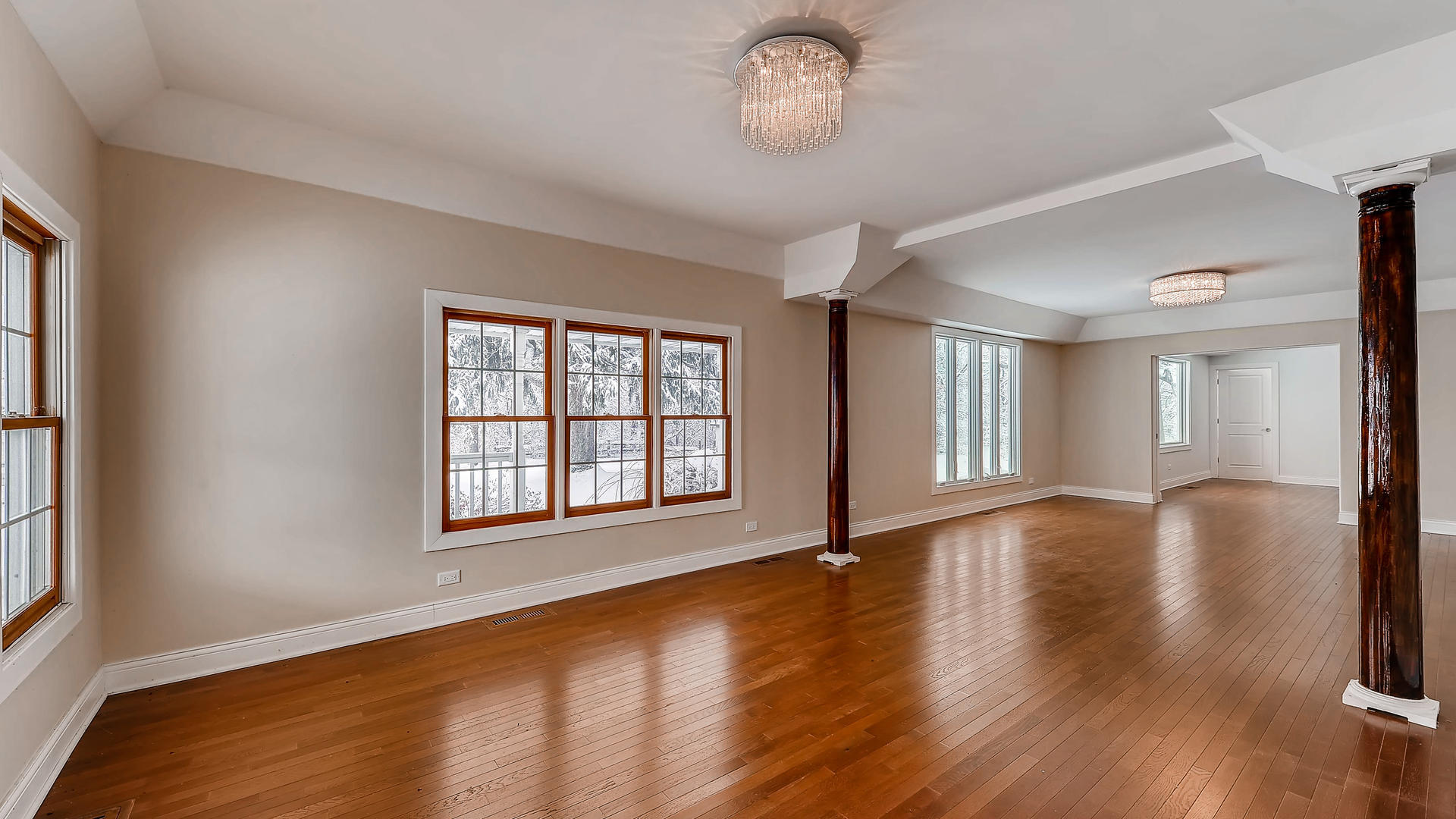 270 Country Commons Road Cary, IL 60013 - Photo 5 of 39 an empty room with wooden floor and windows