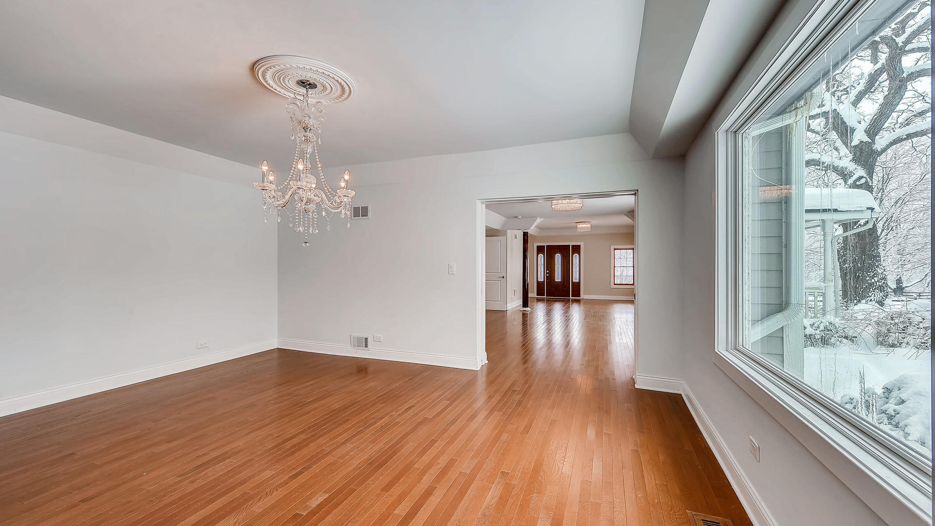 270 Country Commons Road Cary, IL 60013 - Photo 8 of 39 a view of a room with wooden floor and large windows