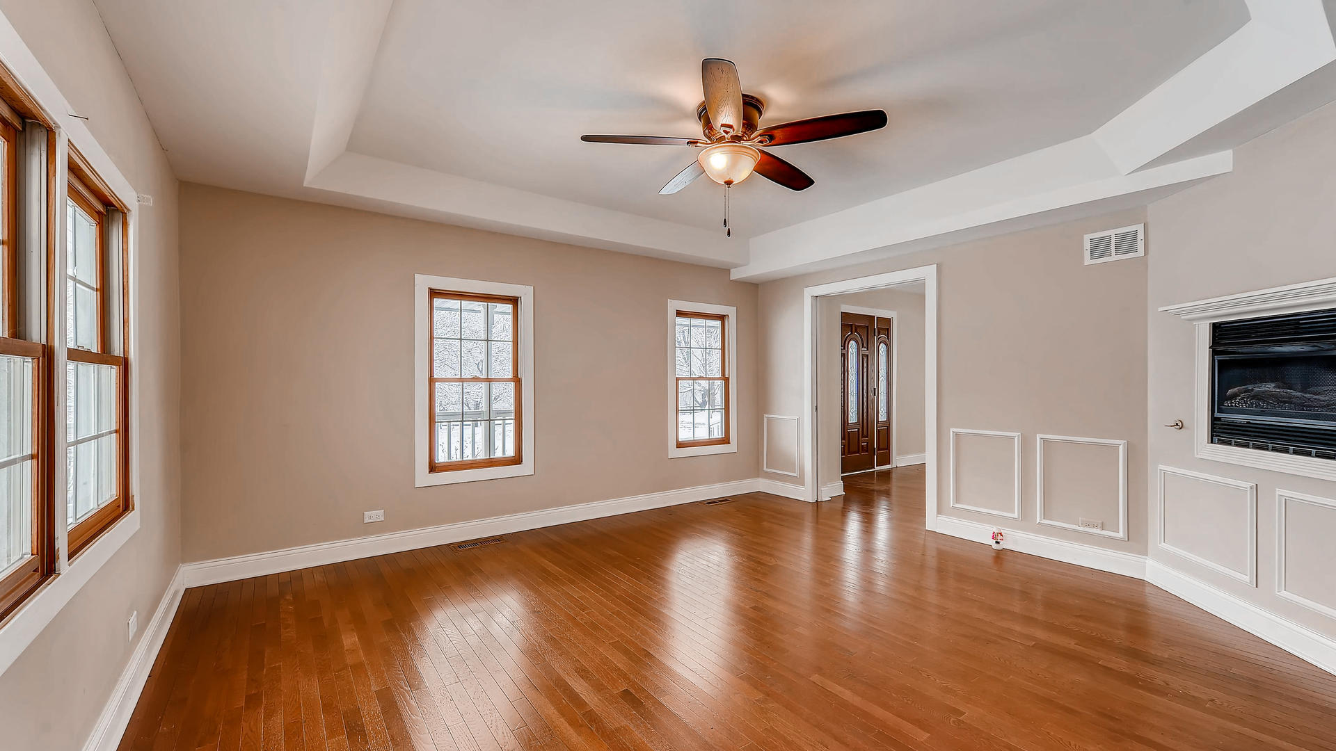 270 Country Commons Road Cary, IL 60013 - Photo 9 of 39 a view of an empty room with window and wooden floor