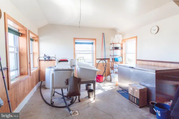 a bed room with a bed and a chair