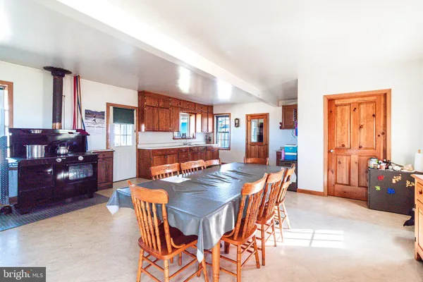 a bathroom with a toilet and a shower curtain