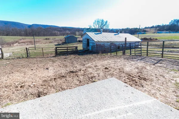a view of a terrace with a table and chairs