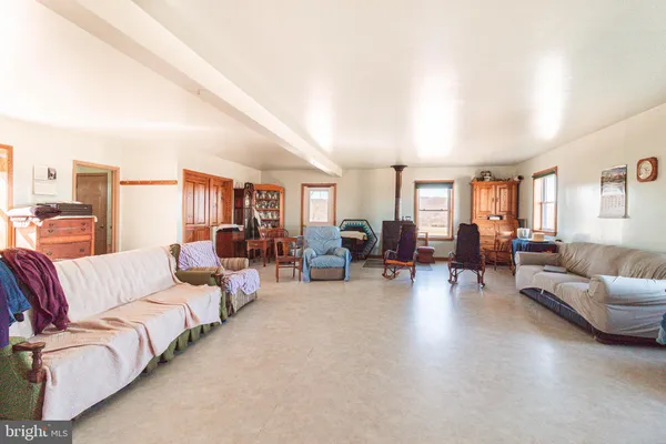 a bathroom with a sink and two mirror