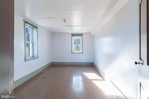 swimming pool view with a seating space