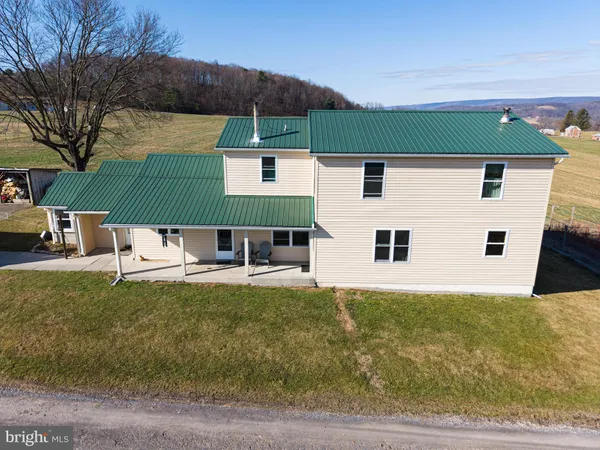 an aerial view of a house with a ocean view