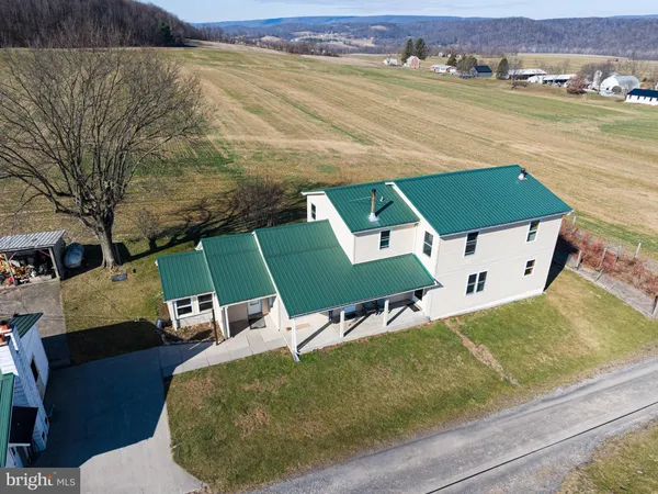 an aerial view of a house with a ocean view