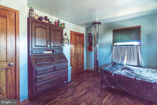 a view of hallway with wooden floor