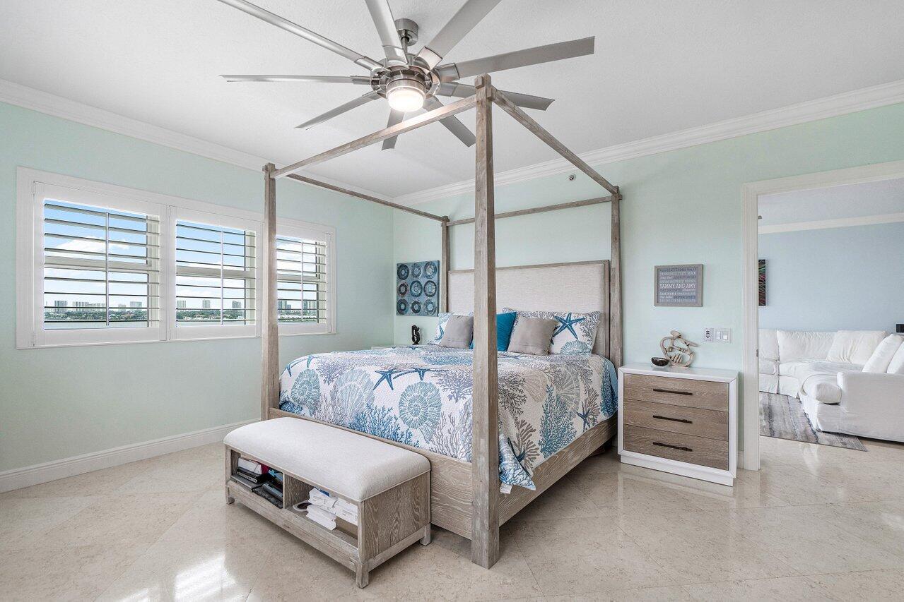 2650 Lake Shore Drive, Unit 701 Riviera Beach, FL 33404 - Photo 17 of 64 a living room with a bed furniture and a window