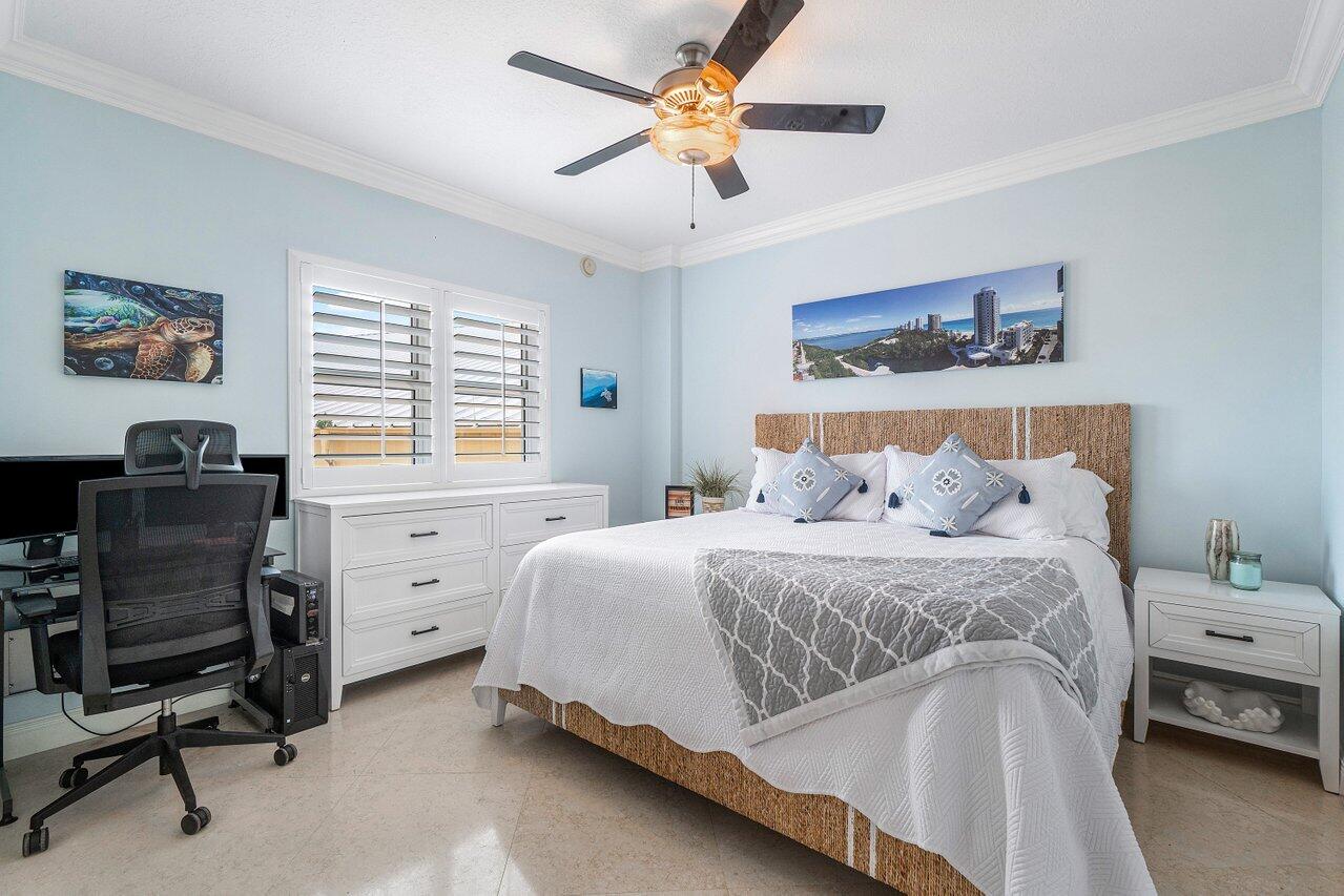 2650 Lake Shore Drive, Unit 701 Riviera Beach, FL 33404 - Photo 25 of 64 a bedroom with a bed and a window