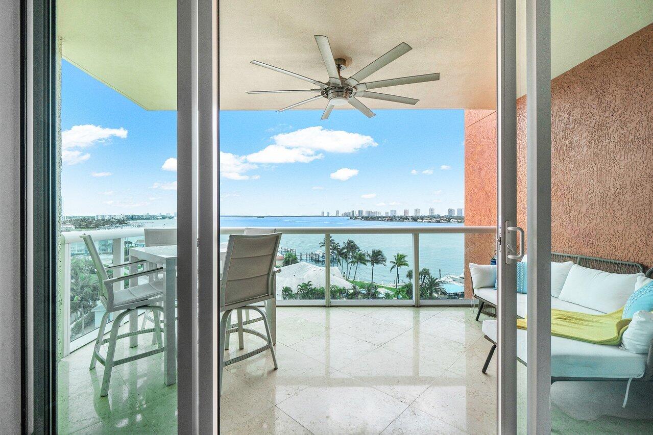 2650 Lake Shore Drive, Unit 701 Riviera Beach, FL 33404 - Photo 29 of 64 a view of a glass door and a balcony