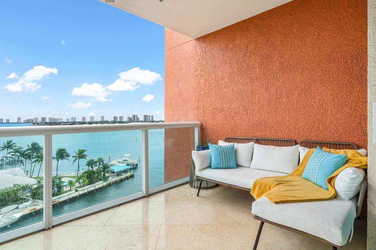 2650 Lake Shore Drive, Unit 701 Riviera Beach, FL 33404 - Photo 30 of 64 a outdoor sitting area with a couch