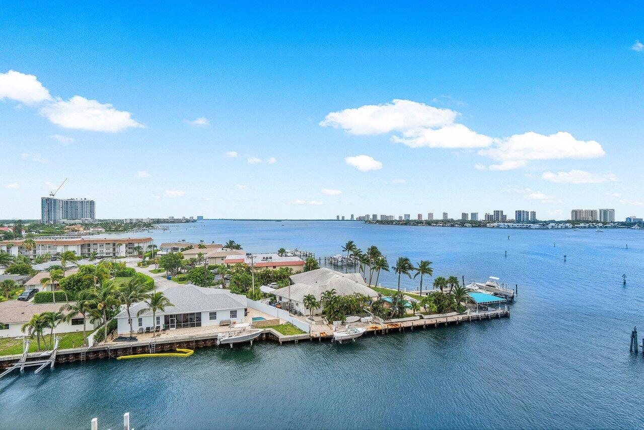 2650 Lake Shore Drive, Unit 701 Riviera Beach, FL 33404 - Photo 32 of 64 a view of a lake with houses