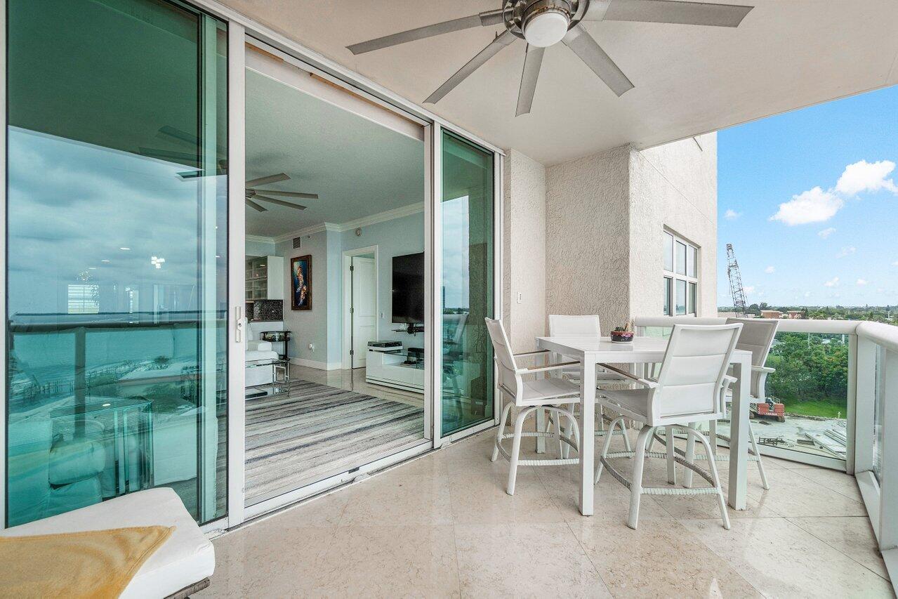2650 Lake Shore Drive, Unit 701 Riviera Beach, FL 33404 - Photo 34 of 64 a dining room with furniture and garden view