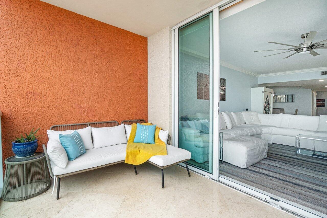 2650 Lake Shore Drive, Unit 701 Riviera Beach, FL 33404 - Photo 35 of 64 a living room with furniture and a couch