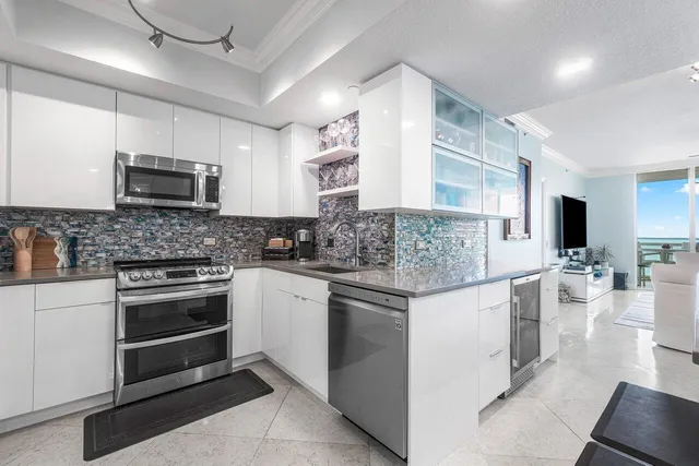a kitchen with a sink and cabinets
