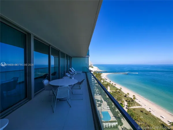 a view of a balcony with an ocean
