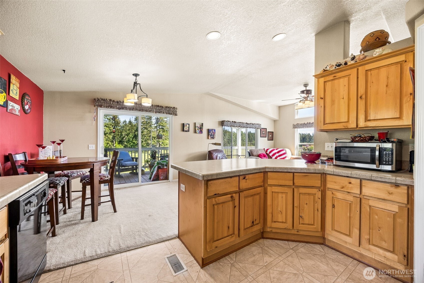 1716 304th Street East Roy, WA 98580 - Photo 16 of 21 a open kitchen with stainless steel appliances granite countertop a stove and a sink with dishwasher
