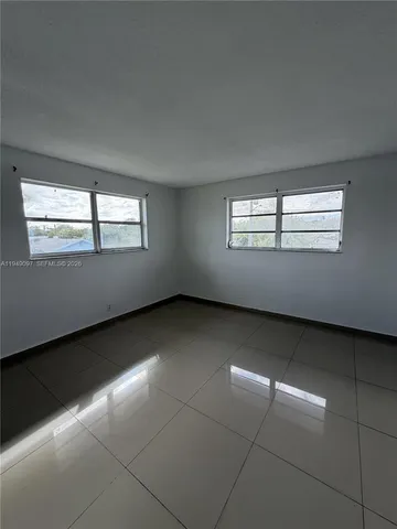 a kitchen with stainless steel appliances granite countertop a stove and a refrigerator