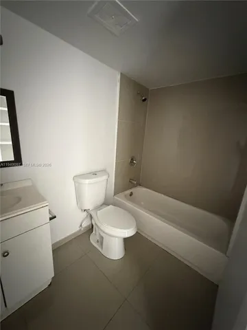 a view of a kitchen with refrigerator and washer