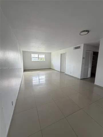 a kitchen that has a sink and a stove