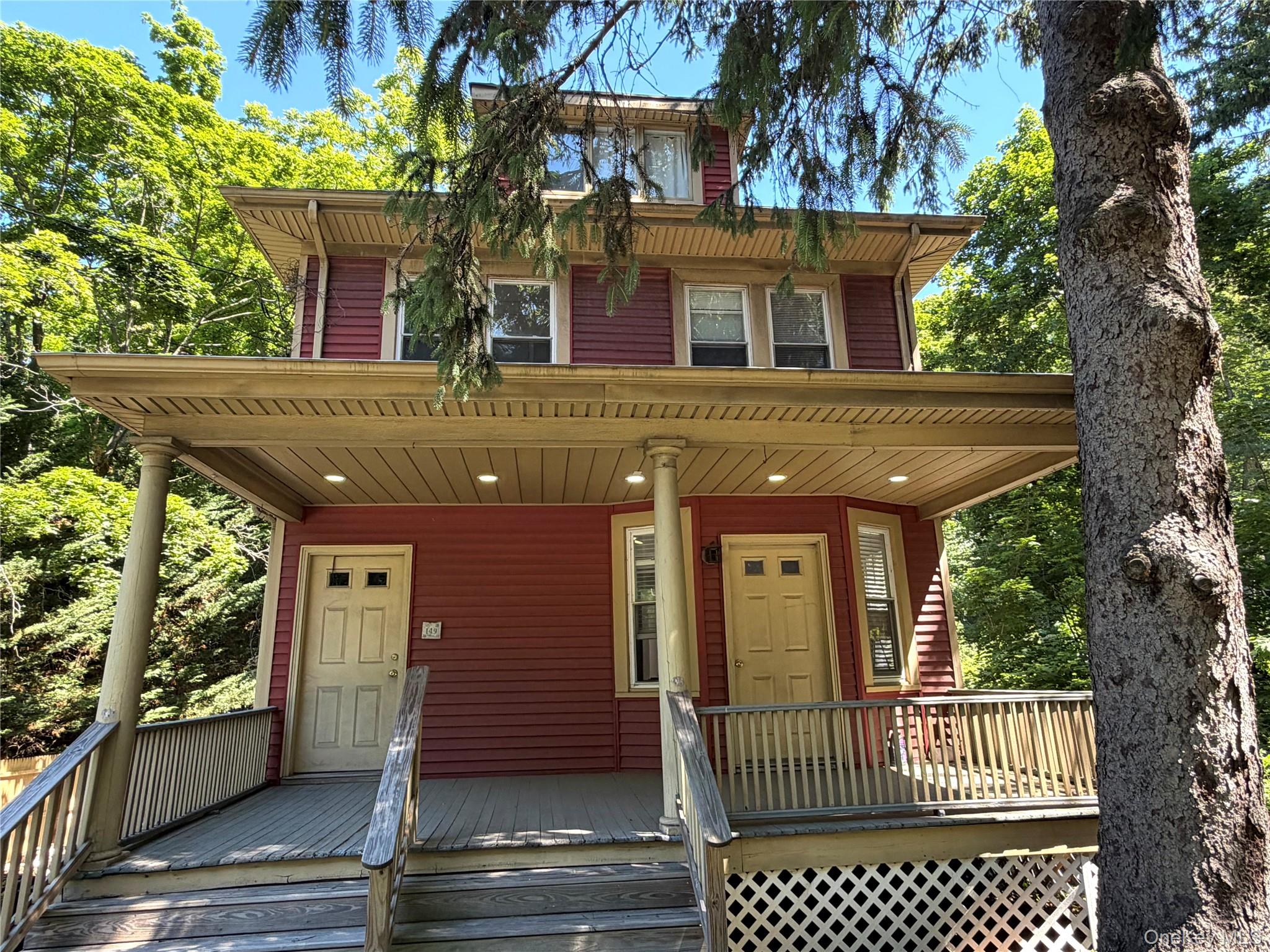 149 Fort Salonga Road Northport, NY 11768 - Photo 11 of 23 Three story property featuring a prominent covered porch with decorative columns