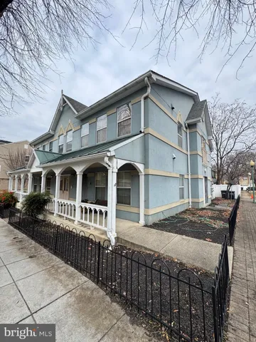 a front view of a house with large windows