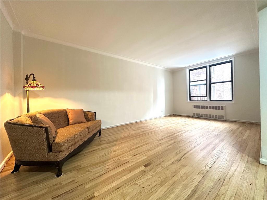 3060 Ocean Avenue, Unit 2C Brooklyn, NY 11235 - Photo 1 of 20 a living room with furniture and a window
