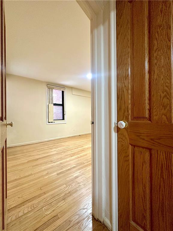 3060 Ocean Avenue, Unit 2C Brooklyn, NY 11235 - Photo 5 of 20 a view of an empty room with wooden floor