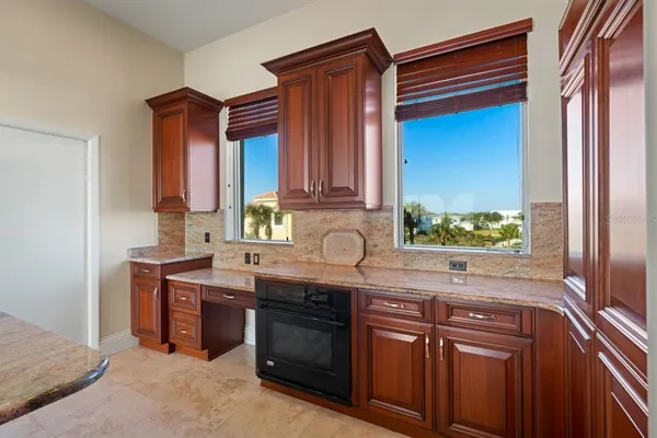 a bedroom with a bed and cabinets