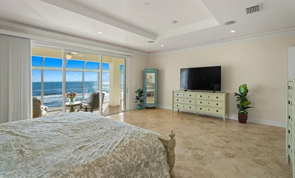 a bedroom with a bed and a couch