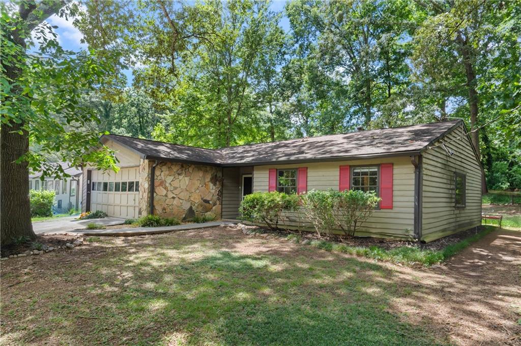 573 Fieldstream Way Northwest Lawrenceville, GA 30044 - Photo 1 of 20 a front view of a house with garden