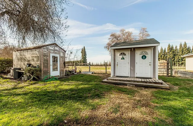 a view of backyard with a garden and entertaining space