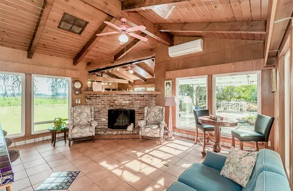 a very nice looking dining room with a large window